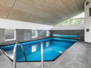 The swimming pool at or close to 9 person holiday home in Fars