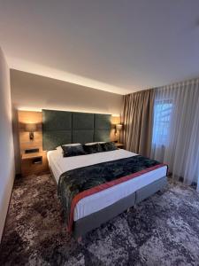 Postel nebo postele na pokoji v ubytování Appartment-Hotel-Hölzl