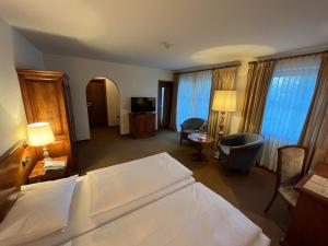 Postel nebo postele na pokoji v ubytování Appartment-Hotel-Hölzl