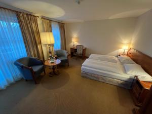 Postel nebo postele na pokoji v ubytování Appartment-Hotel-Hölzl