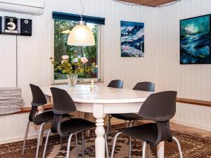 a dining room with a table and chairs at 6 person holiday home in Hemmet in Hemmet