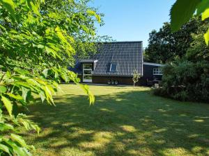 a house with a large yard in front of it at 6 person holiday home in Hemmet in Hemmet