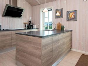 een keuken met een groot eiland en een wastafel bij 10 person holiday home in Ansager in Ansager