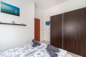 Postel nebo postele na pokoji v ubytování Grand 56 Apartman-Keszthely