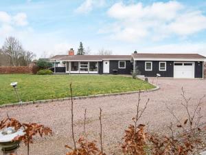 a house with a large yard in front of it at 6 person holiday home in Silkeborg in Silkeborg