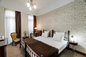 Łóżko lub łóżka w pokoju w obiekcie Boutique Hotel Villa Mtiebi