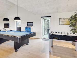 a billiard room with a pool table in it at 20 person holiday home in Stege in Stege