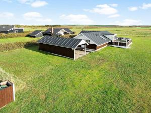 an overhead view of a row of houses in a field at 8 person holiday home in Harbo re in Harboør