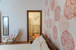 En eller flere senge i et værelse på Casa di Marco