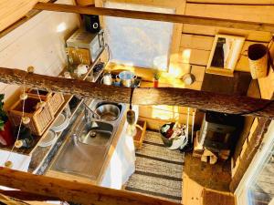 an overhead view of a kitchen with a sink at Romantic Cabin right on the lake with fire place in Stjärnsund