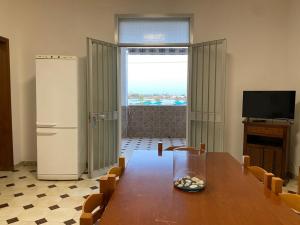 Telewizja i/lub zestaw kina domowego w obiekcie Casa di Diego - Primo Piano By Cala Salento
