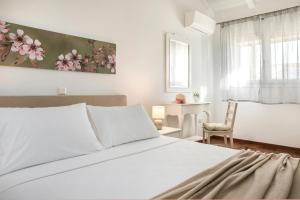 Postel nebo postele na pokoji v ubytování Apollonides Seafront Villa1 Aoede