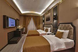 TV a/nebo společenská místnost v ubytování ANEMON MARDIN OTEL