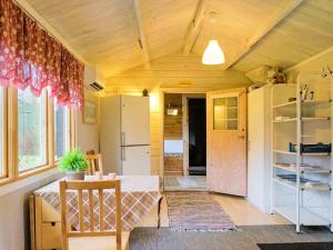 a small room with a table and a kitchen at 4 person holiday home in SANDHEM in Sandhem +23 photos