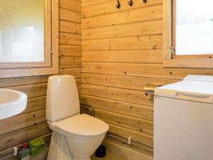 a bathroom with a toilet and a sink at 4 person holiday home in SANDHEM in Sandhem