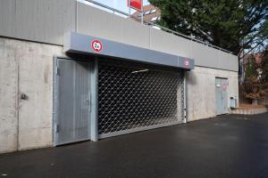 a building with a garage with a gate in it at Hotel Astoria am Urachplatz in Stuttgart