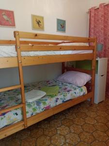 a bedroom with two bunk beds in a room at Houpla Porto Cristo in Porto Cristo