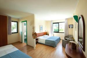 Postel nebo postele na pokoji v ubytování Hotel Falcone