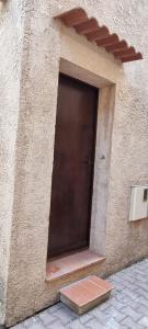 a door in the side of a building at Studio Cosy près du Lac in Sainte-Croix-de-Verdon