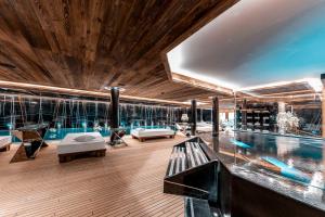 a house with a swimming pool and a swimming pool at Ultima Gstaad in Gstaad