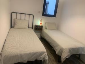 Postel nebo postele na pokoji v ubytování CAN MARTINEZ Calella Beach Boutique Apartment