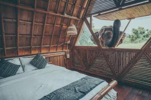 an elephant is looking out the window of a room at Chai Lai Orchid in Chiang Mai