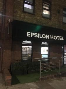 a hotel sign on the side of a building at Epsilon Hotel in London