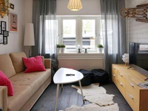 a living room with a couch and a table at 7 person holiday home in S LEN in Sälen