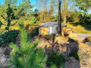 a small cabin in the middle of a forest at 7 person holiday home in L s in Læsø