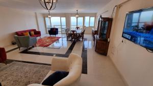 A television and/or entertainment centre at Alex sea view apartment - families only