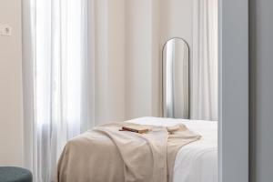 Posteľ alebo postele v izbe v ubytovaní Apartamentos Líbere Granada Catedral