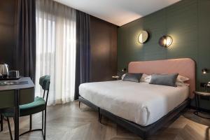 Una cama o camas en una habitación de Hotel Forte del 48