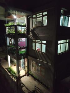 an overhead view of a building with a balcony at Zimkha Imm Homestay, Gangtok in Gangtok
