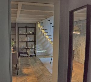 a hallway with chairs and a dining room at Loft Royal des Promenades in Reims
