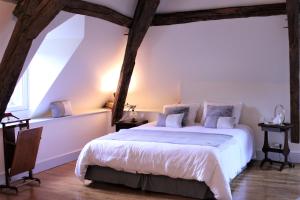 מיטה או מיטות בחדר ב-Chambre d'hôtes "Au bord de Loire"