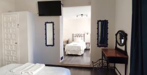 Posteľ alebo postele v izbe v ubytovaní Casa Consell Bailen, Guest House