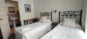 Posteľ alebo postele v izbe v ubytovaní Casa Consell Bailen, Guest House