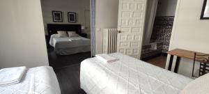 Posteľ alebo postele v izbe v ubytovaní Casa Consell Bailen, Guest House