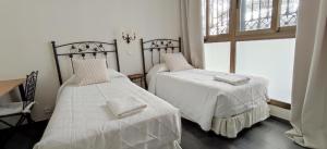 Posteľ alebo postele v izbe v ubytovaní Casa Consell Bailen, Guest House