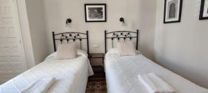 Posteľ alebo postele v izbe v ubytovaní Casa Consell Bailen, Guest House