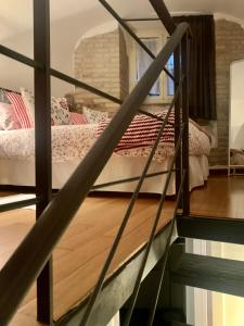 A bed or beds in a room at L’ARTSHOP