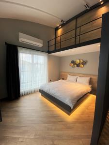 Postel nebo postele na pokoji v ubytování Z-Suites