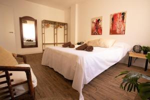 Un pat sau paturi într-o cameră la Marea Fuerteventura Home 2