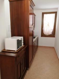 A kitchen or kitchenette at Vecchio Faro Residence
