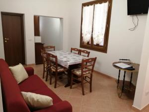 A television and/or entertainment centre at Vecchio Faro Residence