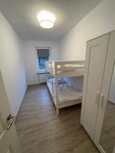 a small room with two bunk beds in it at strandnahe 3-Zimmer Wohnung direkt am Yachthafen in Kiel