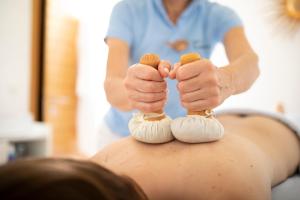 a man getting a massage at a spa with meringue at Hotel Tann in Collalbo +148 photos