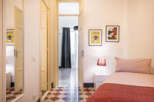 Posteľ alebo postele v izbe v ubytovaní Casa Rorro' nei pressi di Via Roma by Wonderful Italy