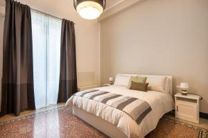 Posteľ alebo postele v izbe v ubytovaní Casa Rorro' nei pressi di Via Roma by Wonderful Italy