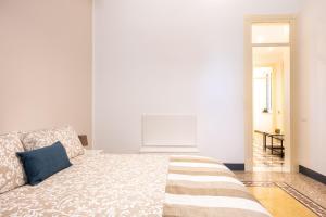 Posteľ alebo postele v izbe v ubytovaní Casa Rorro' nei pressi di Via Roma by Wonderful Italy